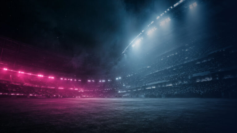 Stadion bei Nacht im magentafarbenen Flutlicht